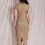 A professional woman wearing a stunning luxurious gold sequined modern qipao dress, featuring a traditional mandarin collar, short cap sleeves, and a slim-fit floor-length silhouette for a formal evening gala.