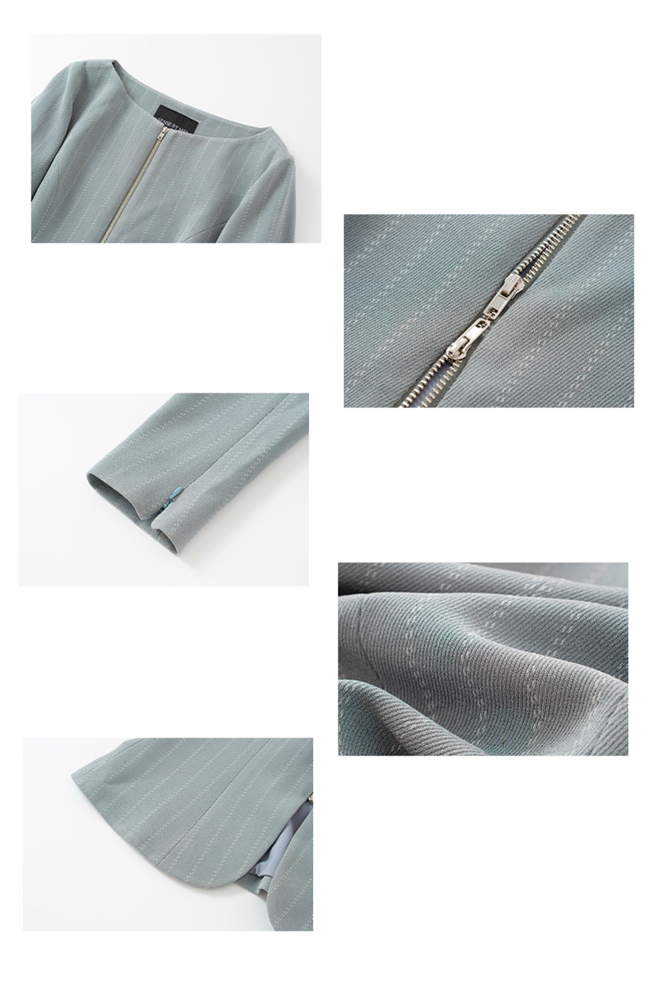 A professional woman wearing a sophisticated grey pinstripe zip-up blazer, featuring a thin white belt with a gold buckle and a tailored slim fit for a modern office look.