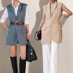 A style comparison showing two ways to wear a longline sleeveless blazer vest: on the left, a slate blue vest layered over a white shirt and cinched with a brown belt worn as a dress with knee-high boots; on the right, an oatmeal beige vest styled with flowing white wide-leg trousers.