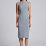 A professional woman wearing a sophisticated light grey pinstripe sleeveless sheath dress, featuring an elegant boat neckline and a tailored slim-fit silhouette for a polished executive look.