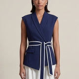 A group of elegant women wearing sophisticated modern qipao dresses in various colors like white, purple, yellow, and black, styled with luxurious fur shawls and embroidery for a high-end social gathering.