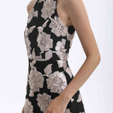 A professional woman wearing a stunning black sleeveless qipao-inspired dress, featuring a chic halter neck with a traditional mandarin collar and large elegant white floral embroidery for a modern oriental evening look.
