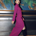 A professional woman in a high-fashion pose wearing a sophisticated purple modern qipao, featuring a classic mandarin collar, sleeveless slim-fit design, and elegant side-fastening buttons with a front slit for a modern oriental look.