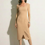 A professional woman modeling an elegant mid-blue midi dress featuring a structured square neckline, delicate cap sleeves, and a flattering high-waisted A-line flare skirt for a sophisticated summer look.