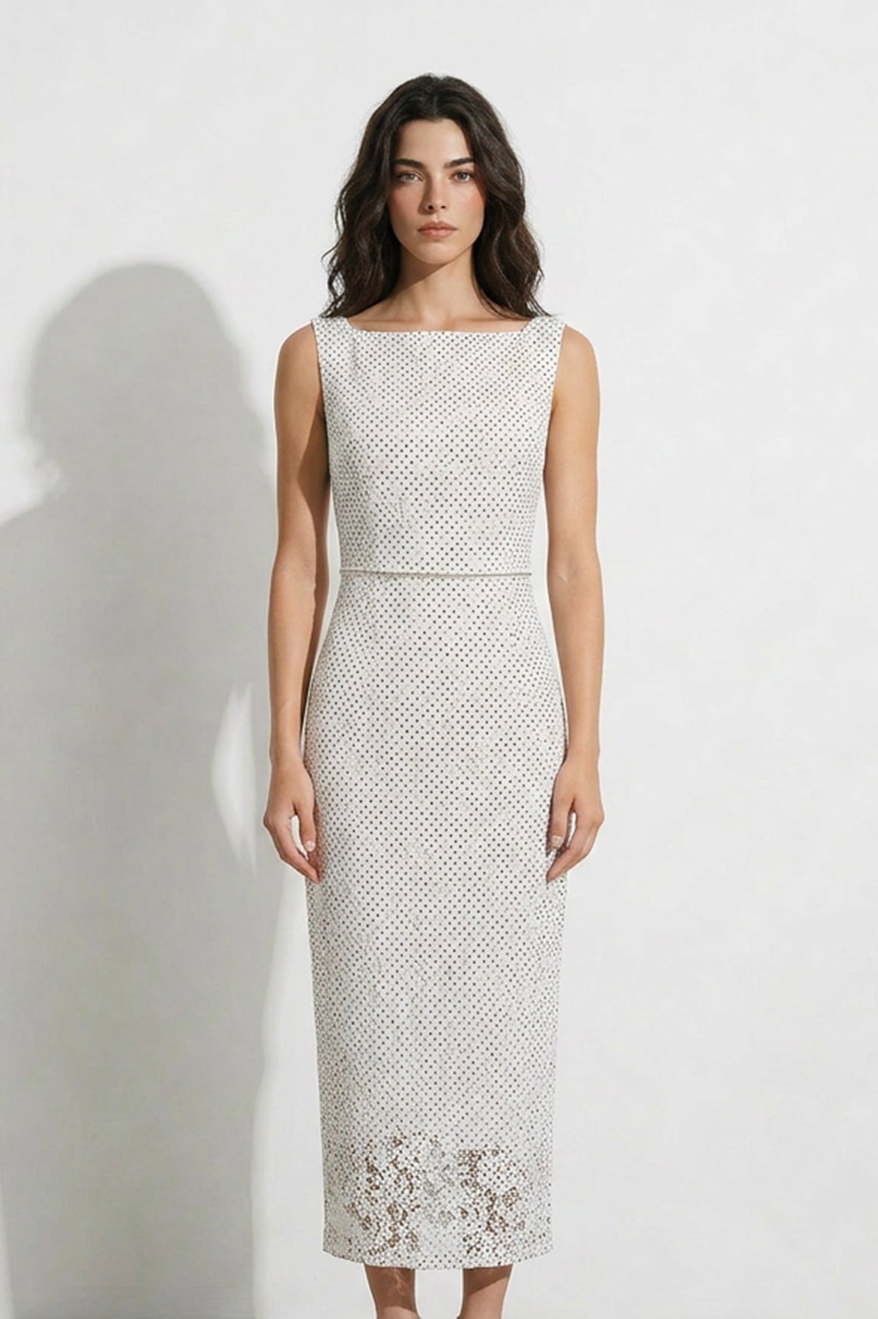 A collection of two professional models wearing elegant white lace midi dresses; the left showcasing a minimalist sleeveless bateau neck sheath dress, and the right featuring a modern Chinese qipao with a sophisticated capelet sleeve detail and traditional mandarin collar.