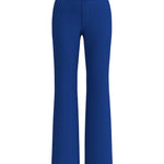A professional woman wearing sophisticated royal blue high-waisted wide-leg trousers, featuring a tailored loose-fit silhouette for a modern and vibrant executive office look.