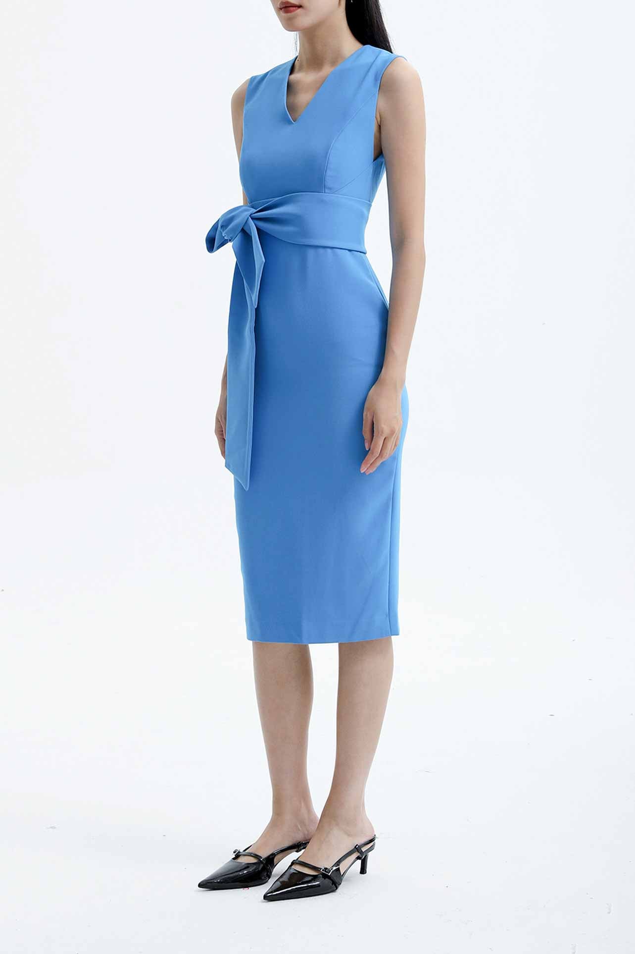 Four women showcasing an elegant v-neck sleeveless sheath dress in black, burgundy, teal green, and lavender pink, featuring a slimming tie-waist design perfect for a modern professional office look.