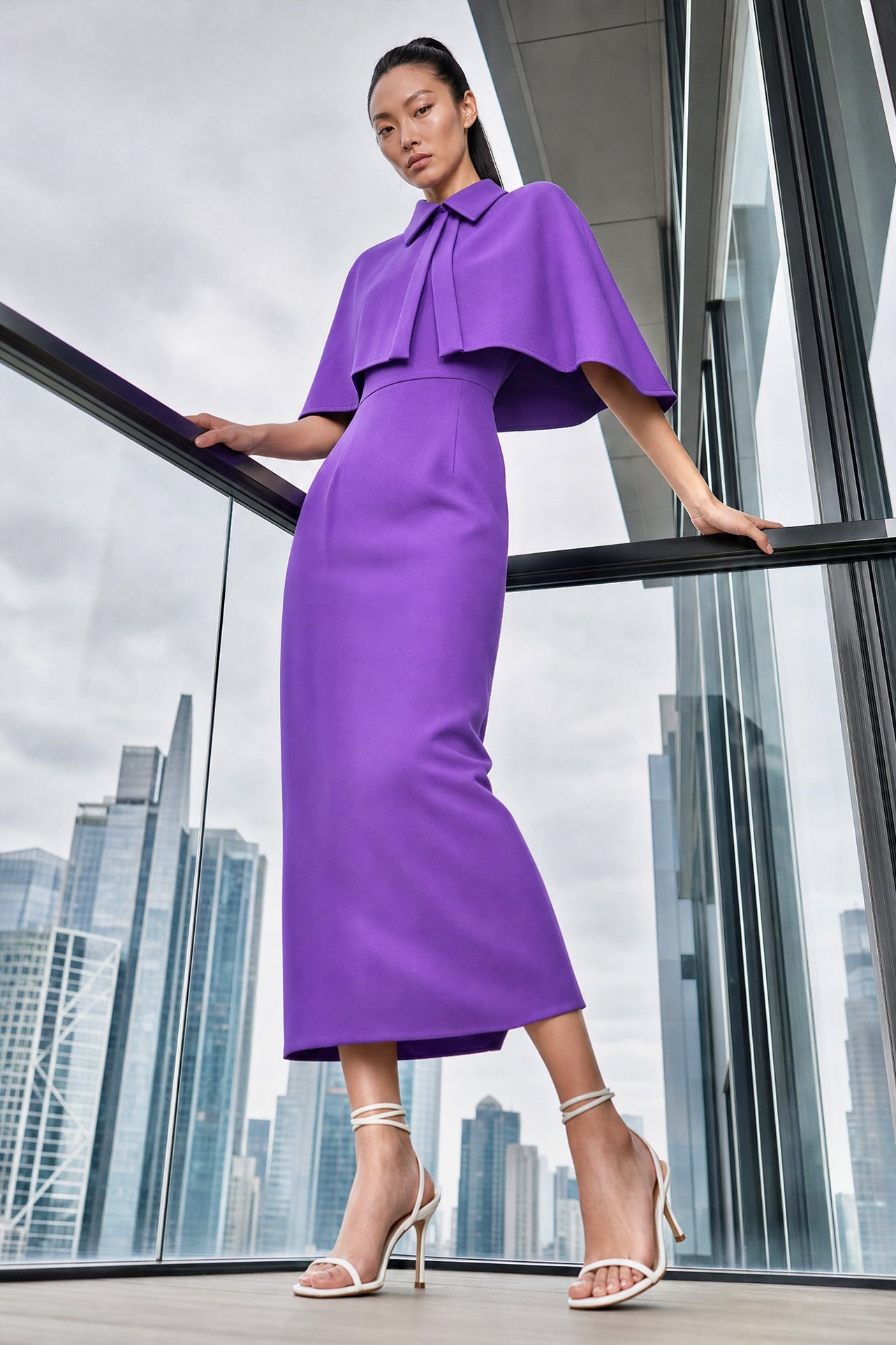 A style comparison of two elegant tailored office sheath midi dresses; the left showcasing a structured vibrant purple dress with a collared capelet sleeve design, and the right featuring a minimalist light grey sleeveless dress with subtle pleated neckline and side pockets.