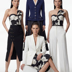 A professional woman wearing a sophisticated one-shoulder black and white floral print top, featuring a dramatic oversized bow detail on the shoulder, paired with white high-waisted trousers for an elegant evening look.