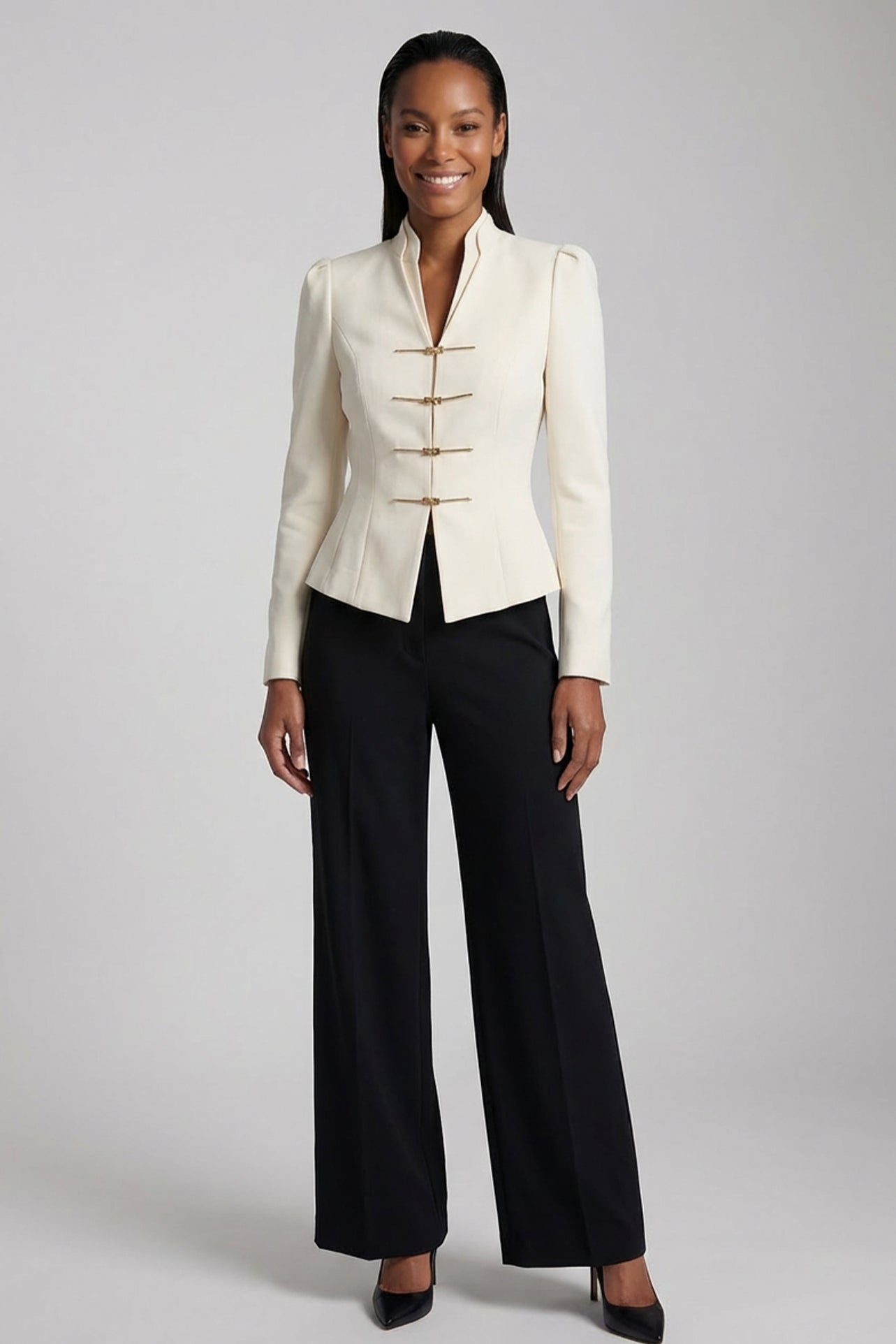 A sophisticated woman enjoying coffee in Paris wearing an elegant cream white modern qipao suit, featuring a mandarin collar blazer with traditional frog buttons and a matching pleated skirt for a quiet luxury oriental look.