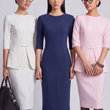 A style comparison of three elegant women modeling tailored three-quarter sleeve crew-neck pencil midi dresses; featured in ivory white and blush pink with a subtle peplum waist and crystal bar detail, and in navy blue with a clean minimalist sheath silhouette.