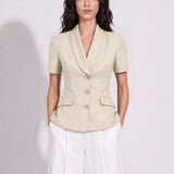 A style comparison of two professional summer short-sleeve blazers featuring an elegant shawl collar, three-button front, and flap pockets; the left shown in vibrant royal blue and the right in sophisticated light beige.