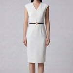 A professional woman wearing a sophisticated solid white sleeveless sheath dress, featuring a flattering V-neckline and an elegant thin black belt with a gold buckle for a polished executive office look.