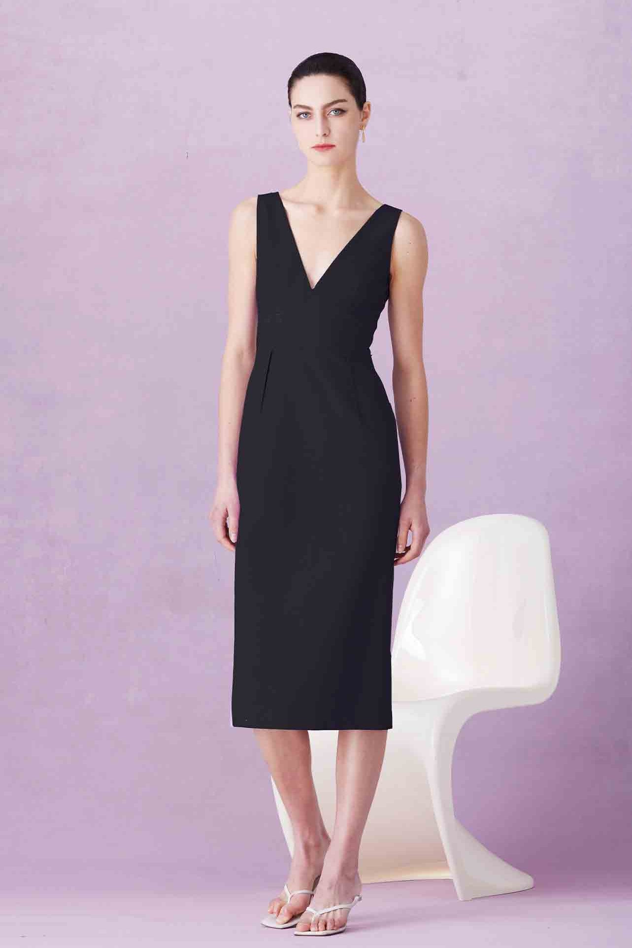 A professional woman showcasing two elegant sleeveless V-neck sheath dresses in classic black and soft lilac purple, featuring functional side pockets and a tailored fit for a polished office look.