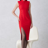 A professional woman wearing a sophisticated black modern qipao, featuring a classic mandarin collar, sleeveless slim-fit silhouette, and elegant side buttons with a high-low slit for a timeless oriental chic look.