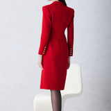 A sophisticated woman walking in London wearing an elegant vibrant red wrap coat dress, featuring a tie-waist belt and notched lapels for a polished executive street style look.