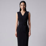 Four women showcasing an elegant v-neck sleeveless sheath dress in black, burgundy, teal green, and lavender pink, featuring a slimming tie-waist design perfect for a modern professional office look.