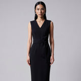 Four women showcasing an elegant v-neck sleeveless sheath dress in black, burgundy, teal green, and lavender pink, featuring a slimming tie-waist design perfect for a modern professional office look.