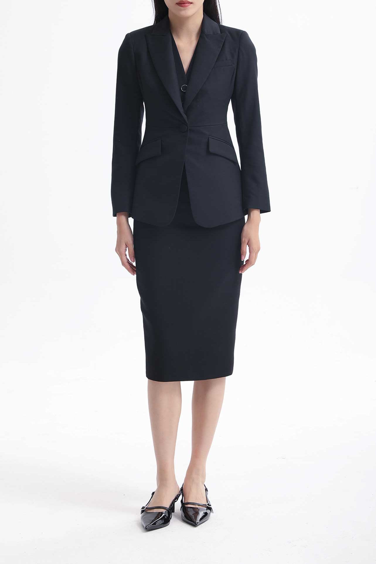 A professional woman wearing a sophisticated black belted blazer dress, featuring a tailored slim-fit silhouette with a waist-defining belt for a powerful executive business look.