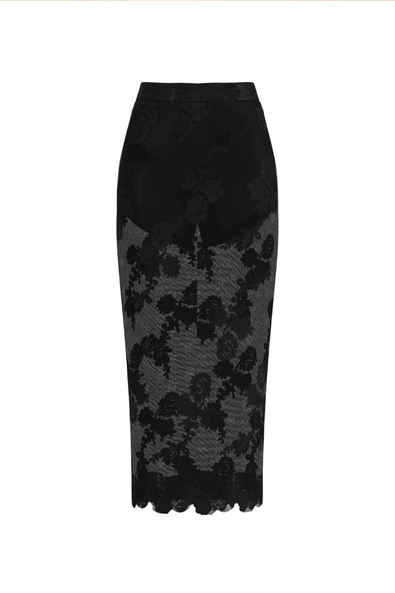 An elegant woman wearing a sophisticated black floral lace midi skirt, featuring a sexy sheer lace overlay with a delicate scalloped hem and a tailored slim fit for a formal evening look.