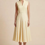 A side-by-side comparison of an elegant pale yellow sleeveless dress in two lengths, featuring a sophisticated mandarin collar, a stylish bow tie-waist, and a pleated A-line skirt for a classic feminine look.