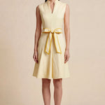 A side-by-side comparison of an elegant pale yellow sleeveless dress in two lengths, featuring a sophisticated mandarin collar, a stylish bow tie-waist, and a pleated A-line skirt for a classic feminine look