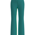 A professional woman wearing sophisticated emerald green high-waisted flare trousers, featuring a tailored slim fit through the hip and a stylish bootcut silhouette for an elegant office look.