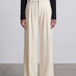 Comparison of elegant navy blue and ivory cream high-waisted wide-leg trousers, featuring sophisticated pleated front details and a tailored relaxed fit for professional office wear.