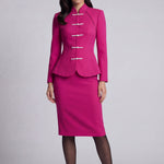 A professional woman wearing a sophisticated beige modern Qipao-inspired skirt suit, featuring a tailored blazer with traditional Chinese frog buttons and a stand collar for an elegant executive office look.