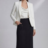 A professional woman wearing a sophisticated high-waisted white pencil skirt featuring elegant double-breasted button decorations and a slimming tailored fit, ideal for corporate business wear.