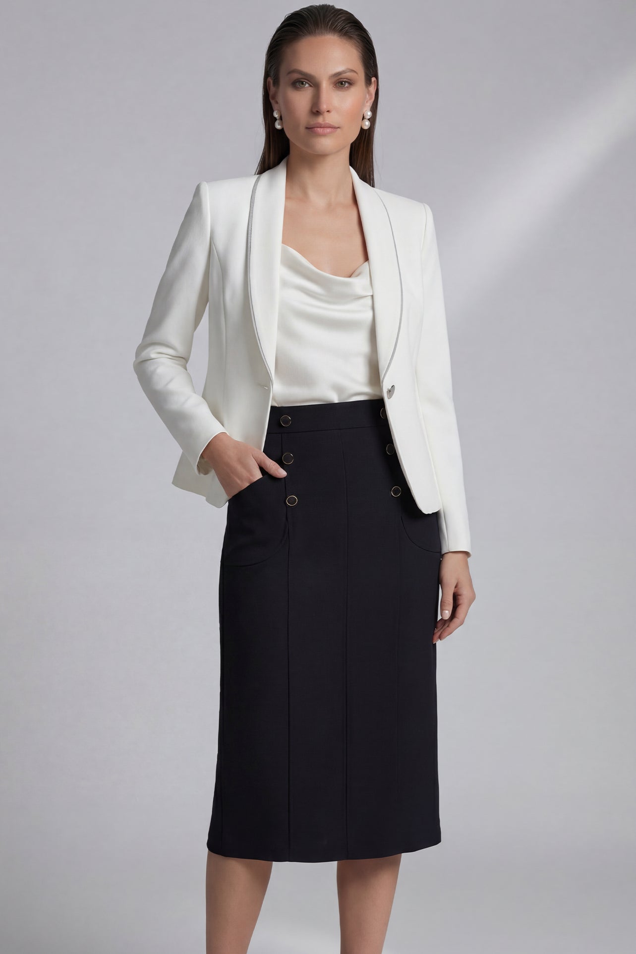 A professional woman wearing a sophisticated high-waisted white pencil skirt featuring elegant double-breasted button decorations and a slimming tailored fit, ideal for corporate business wear.