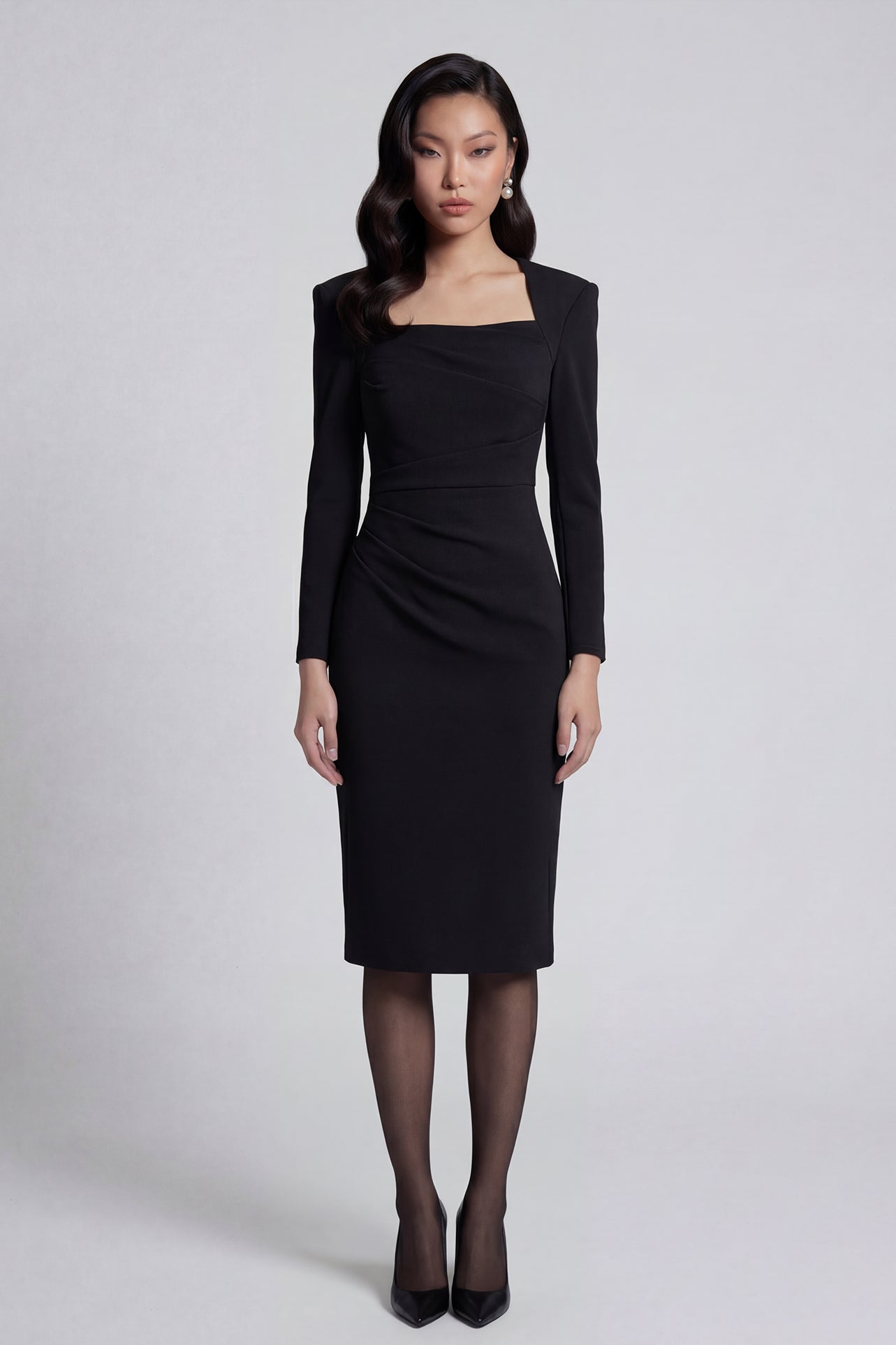 A professional woman wearing a sophisticated deep magenta long-sleeve pencil dress, featuring a unique square neckline and elegant ruched detailing at the waist for a flattering, slim-fit executive look.