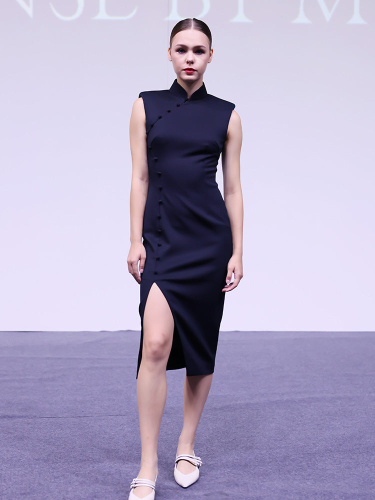 A professional woman wearing a stunning magenta purple sleeveless dress, featuring a traditional mandarin collar, a row of elegant side buttons, and a sophisticated high slit for a modern oriental look.