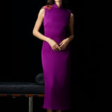 A professional woman wearing a stunning purple satin sleeveless dress, featuring a traditional mandarin collar and delicate floral embroidery on the shoulder for a modern oriental-inspired formal look.