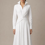 A style comparison of two elegant long-sleeve shirt maxi dresses featuring a unique twist knot waist design; the left showcasing a minimalist solid white dress with a popped collar, and the right featuring a classic blue and white vertical striped dress with a flattering A-line flare skirt.