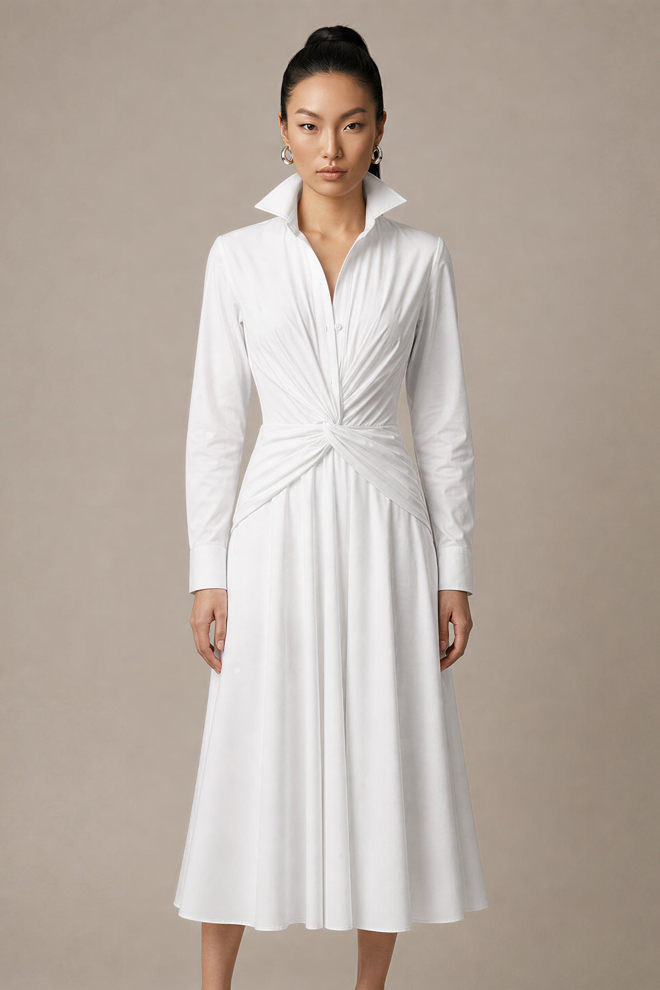 A style comparison of two elegant long-sleeve shirt maxi dresses featuring a unique twist knot waist design; the left showcasing a minimalist solid white dress with a popped collar, and the right featuring a classic blue and white vertical striped dress with a flattering A-line flare skirt.