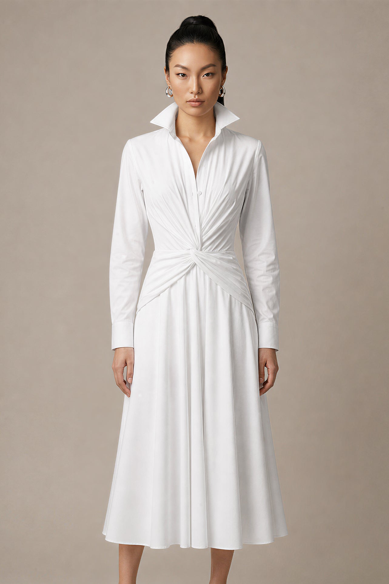 A style comparison of two elegant long-sleeve shirt maxi dresses featuring a unique twist knot waist design; the left showcasing a minimalist solid white dress with a popped collar, and the right featuring a classic blue and white vertical striped dress with a flattering A-line flare skirt.