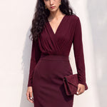 A style comparison of two elegant long-sleeve V-neck wrap tops featuring delicate shoulder pleating and a sleek tucked-in fit; the left in warm camel paired with cream trousers, and the right in deep burgundy paired with black trousers.