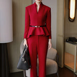 A style comparison of three women wearing tailored two-piece power suits featuring long-sleeve split V-neck jackets with dramatic asymmetrical peplum hems and matching cuffed wide-leg trousers; shown in vibrant crimson red, deep navy blue, and pale ice blue.