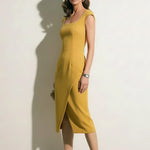 A professional woman modeling an elegant mid-blue midi dress featuring a structured square neckline, delicate cap sleeves, and a flattering high-waisted A-line flare skirt for a sophisticated summer look.