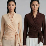 Two models presenting versatile textured wrap tops in cream and dark chocolate, featuring a slimming V-neck and elegant side-tie waist, styled with a tan pencil skirt and white high-waisted trousers.