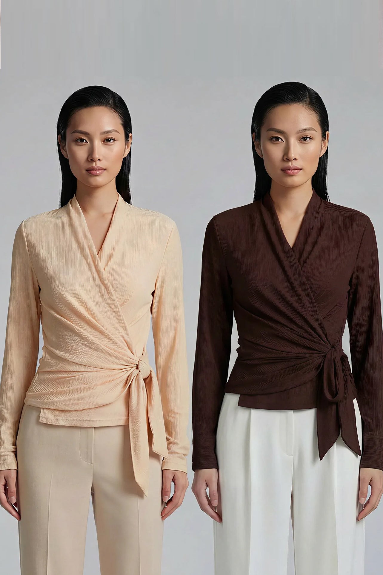 Two models presenting versatile textured wrap tops in cream and dark chocolate, featuring a slimming V-neck and elegant side-tie waist, styled with a tan pencil skirt and white high-waisted trousers.