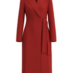 A sophisticated woman walking in London wearing an elegant vibrant red wrap coat dress, featuring a tie-waist belt and notched lapels for a polished executive street style look.