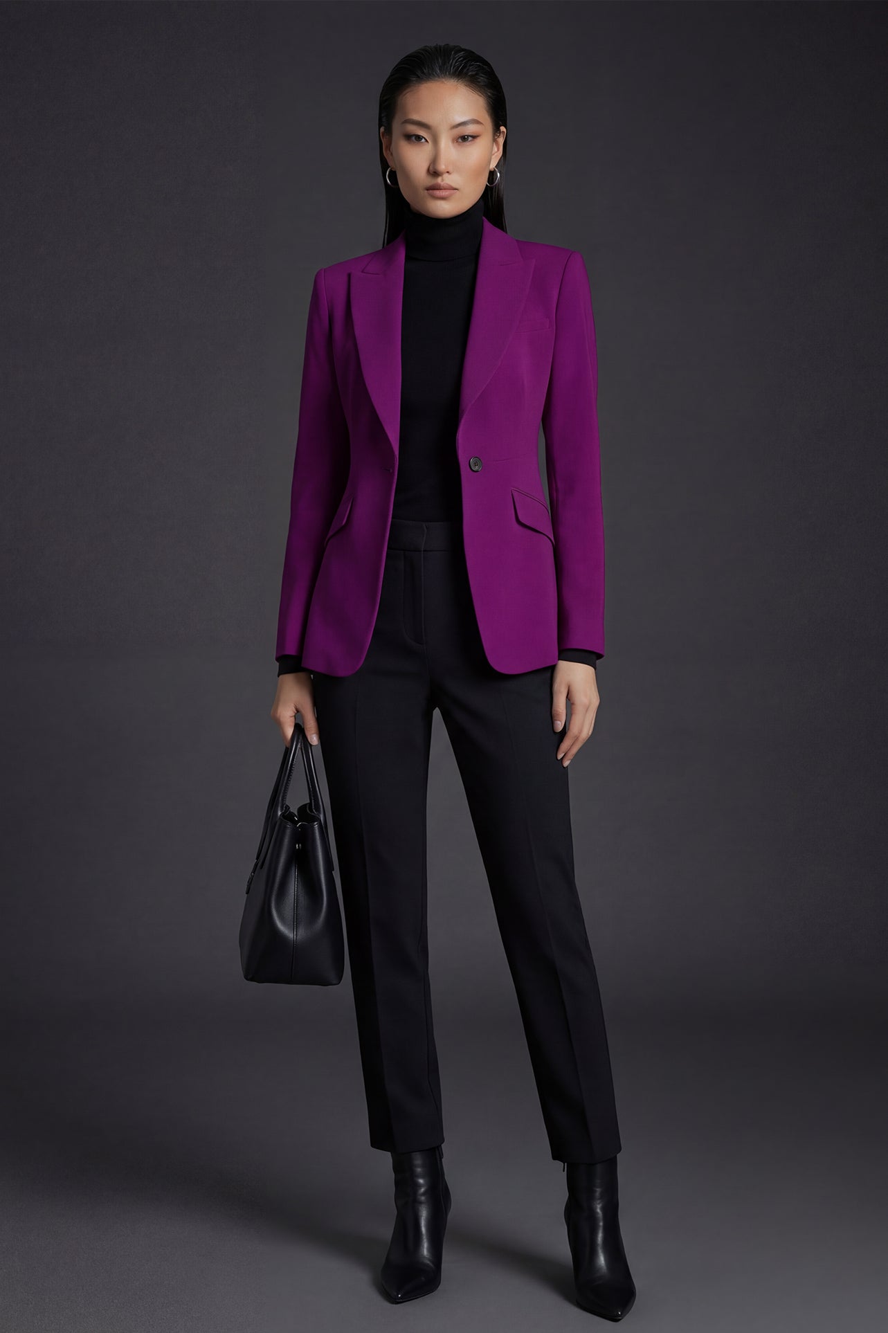 A professional woman wearing a sophisticated black belted blazer dress, featuring a tailored slim-fit silhouette with a waist-defining belt for a powerful executive business look.