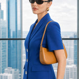 A style comparison of two professional summer short-sleeve blazers featuring an elegant shawl collar, three-button front, and flap pockets; the left shown in vibrant royal blue and the right in sophisticated light beige.