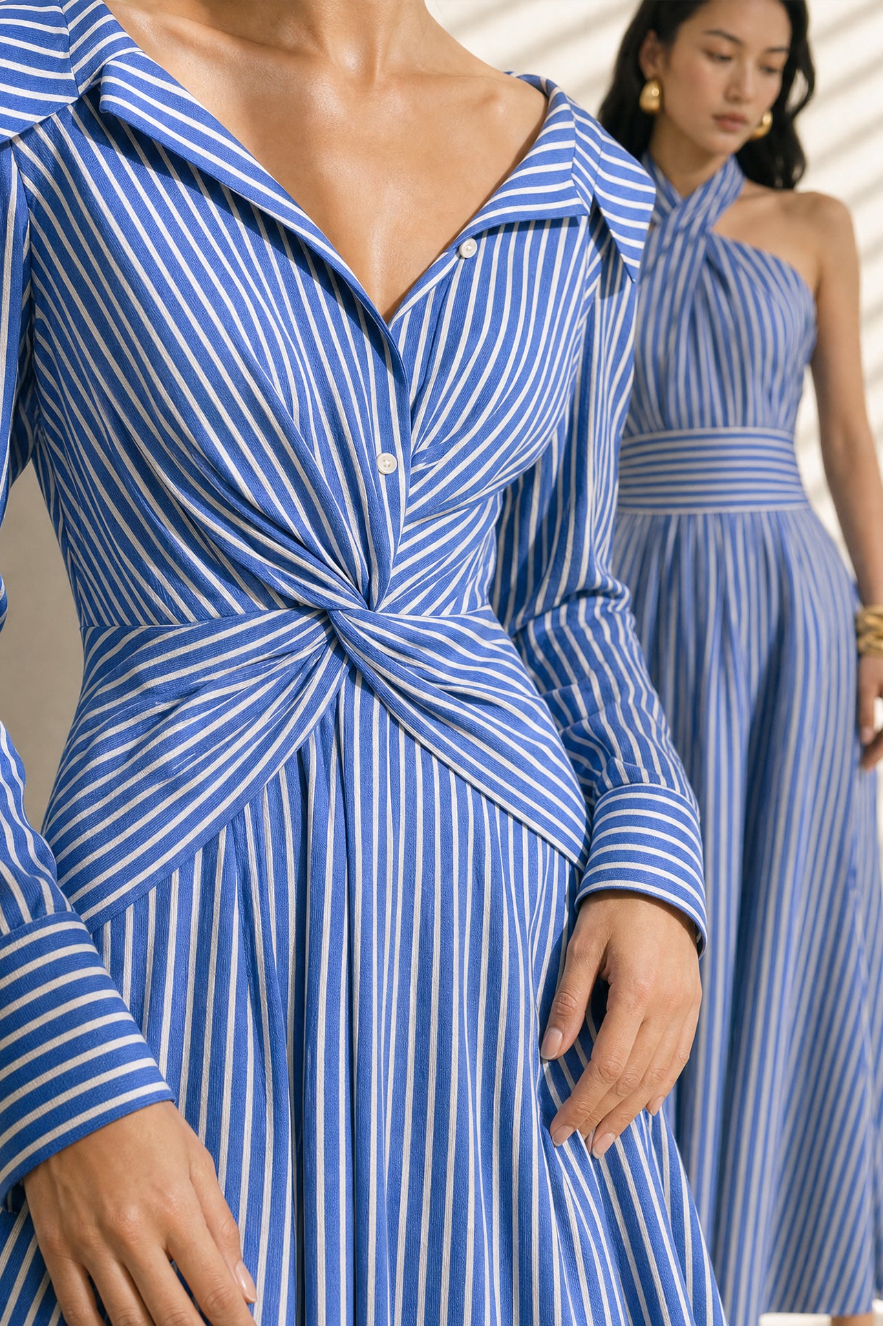 A style comparison of two elegant long-sleeve shirt maxi dresses featuring a unique twist knot waist design; the left showcasing a minimalist solid white dress with a popped collar, and the right featuring a classic blue and white vertical striped dress with a flattering A-line flare skirt.