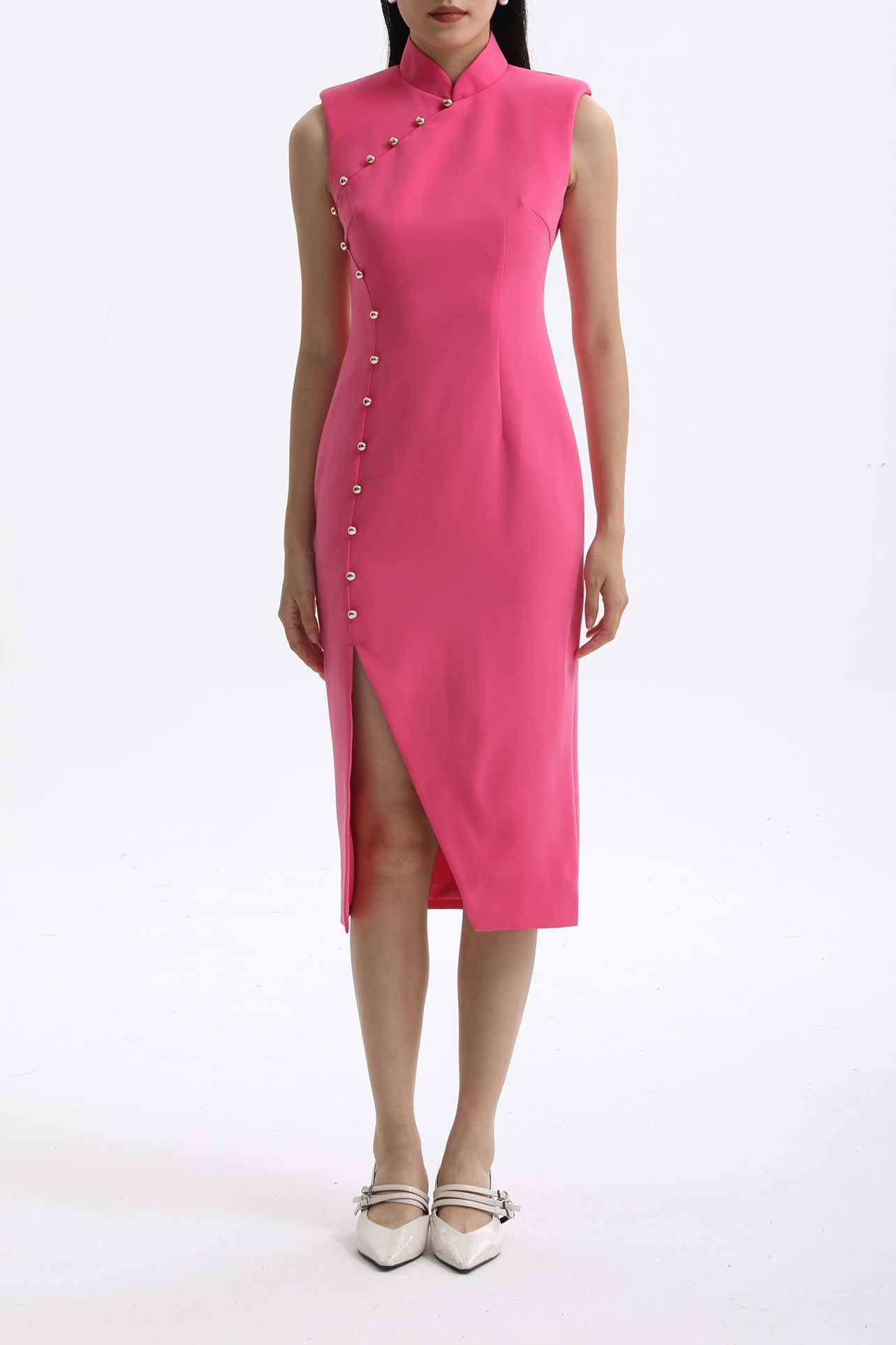 A professional woman wearing a vibrant hot pink modern qipao dress, featuring a classic mandarin collar, sleeveless design, and elegant gold button side-fastening with a sophisticated slit for an oriental chic look.